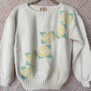 Vintage sweater with floral print on the front.